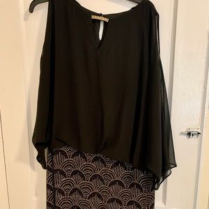 Black with silver/gold design on the bottom. Size 18.